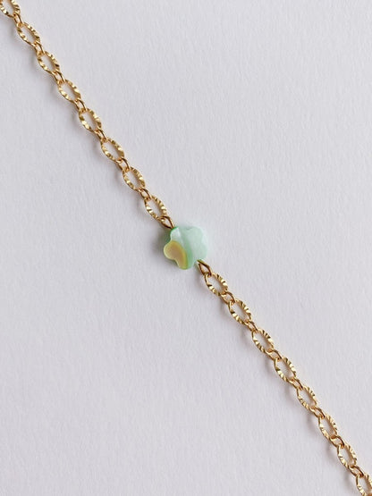 sparkly gold chain with flower bead